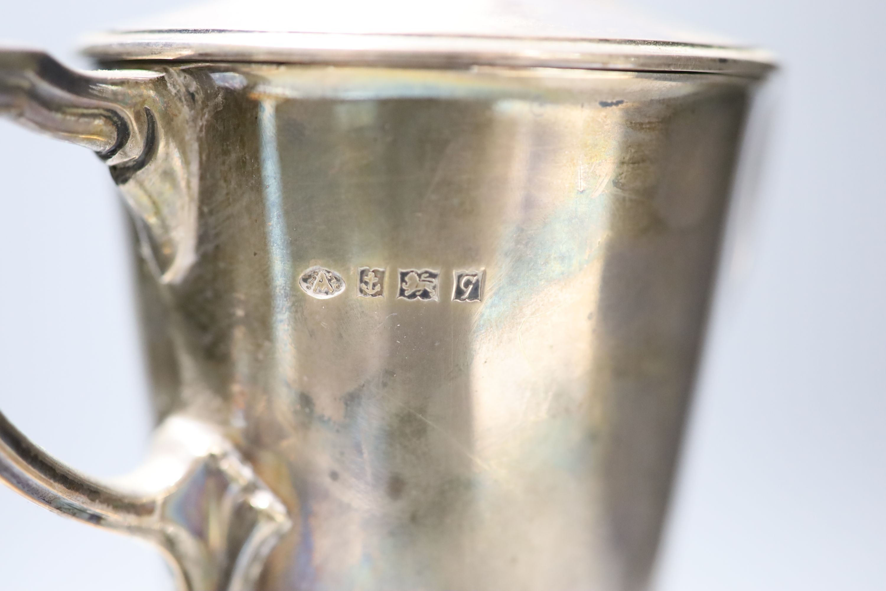A 1950's silver two handled presentation trophy cup and cover, Adie Brothers, Birmingham, 1956, height 29.3cm, 12.5oz, on wooden socle.